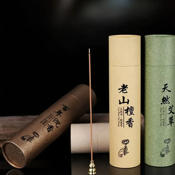 A Box of 500 Incense Sticks, 21cm Long, with the Scent of Sandalwood and Medicinal Mugwort, Suitable for Aromatherapy. They Were Placed on a Wooden Board, and the Board Was Placed on a Support. Home Decoration Products for Us